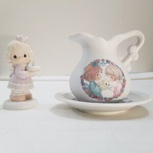 Precious Moements. One tea set and the other is a birthday girl